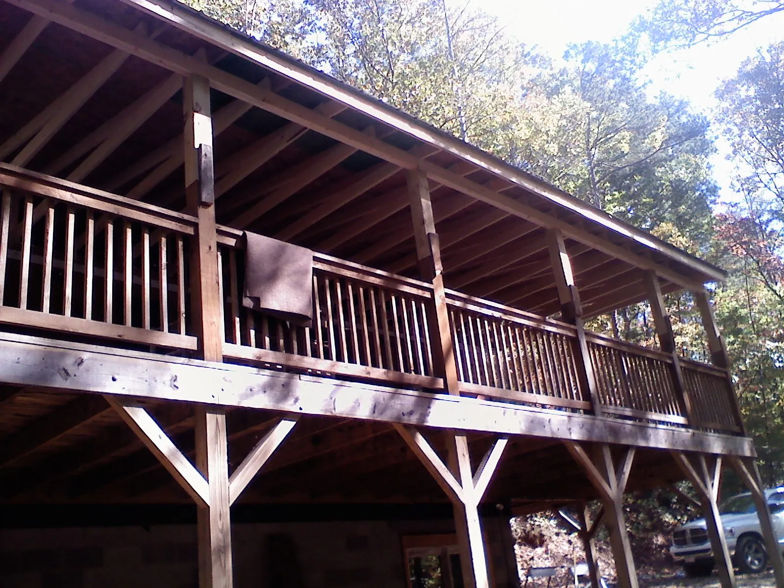Timber framing under a new elevated porch and deck — Roof Leak Repair in Wallpack Center by Roofing Brothers